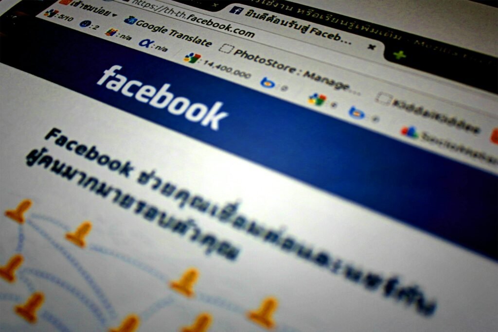 Home High-angle shot of the Facebook website homepage displayed on a computer screen in Thai language.